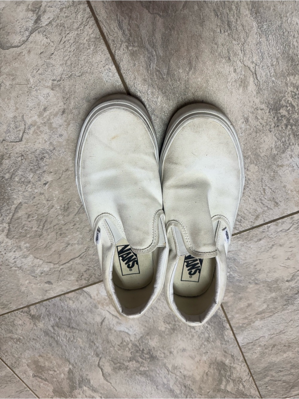 Vans women’s Slip-On Sneakers in White